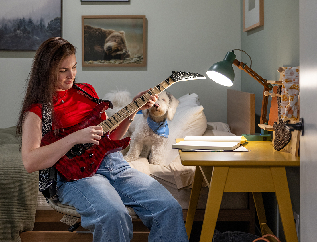 young woman playing guitar